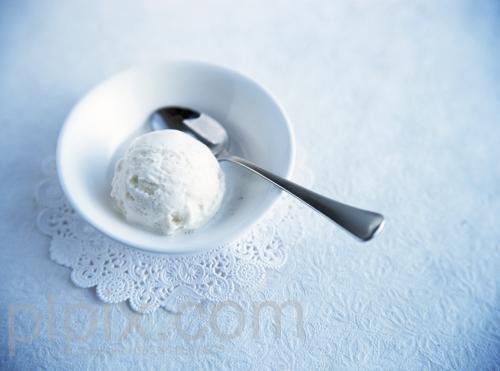 ice cream in bowl with spoon on dolly