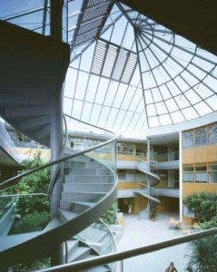 Scott, Tallon and Walker architects- stw - RTE Administrative building Glass Atrium with plants and timber cladding and stairs