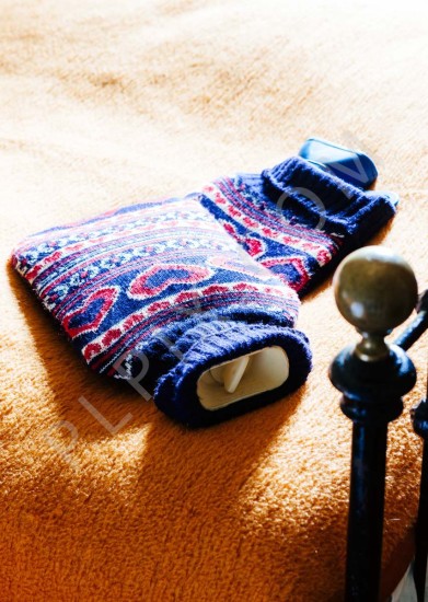 Interior photography of a bedroom detail of a hot water bottle