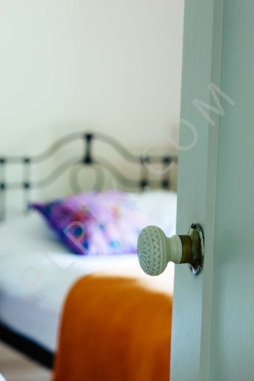 Interior photography of a Bedroom detail door knob