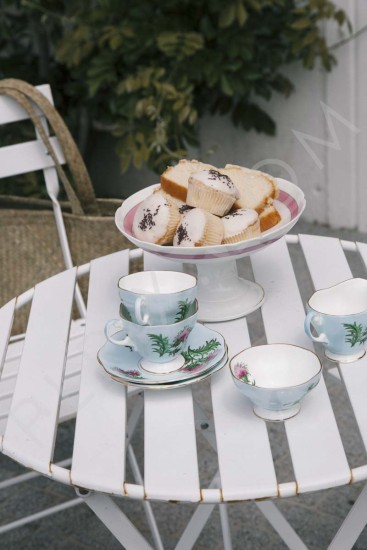 Exterior patio furniture table setting cakes