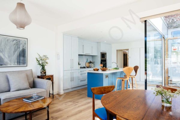 Kitchen restoration and extension with open plan dining and living room glass wall timber flooring side tables