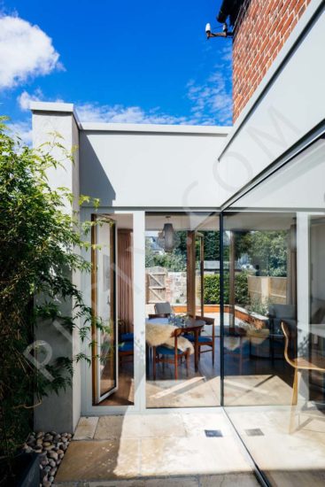 Court Yard views to Kitchen restoration and extension with open plan dining and living room