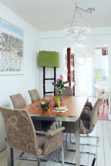 A contemporary retro restoration to a kitchen with a pink floor
