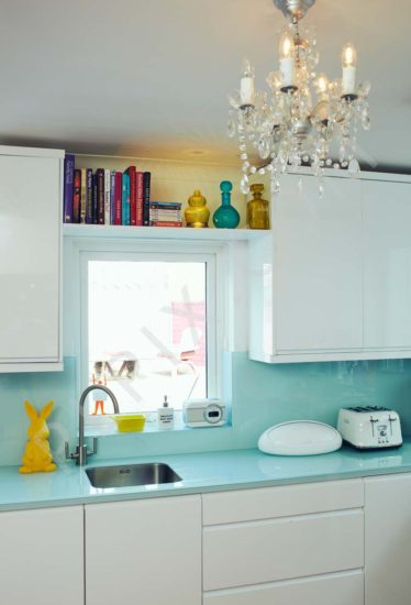 Kitchen restoration chandelier countertop storage sink area book shelf window