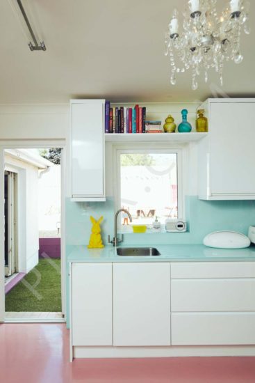 Kitchen restoration chandelier countertop storage sink area book shelf window
