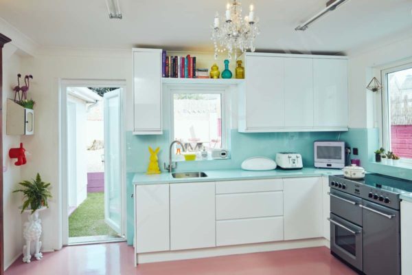 Kitchen restoration chandelier countertop storage sink area book shelf window