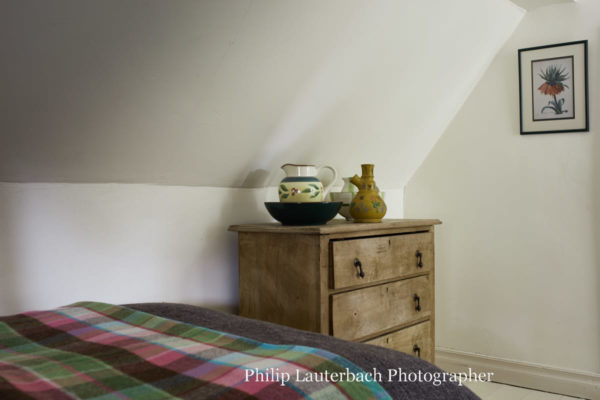 bedroom side dresser slanted ceiling jug artwork
