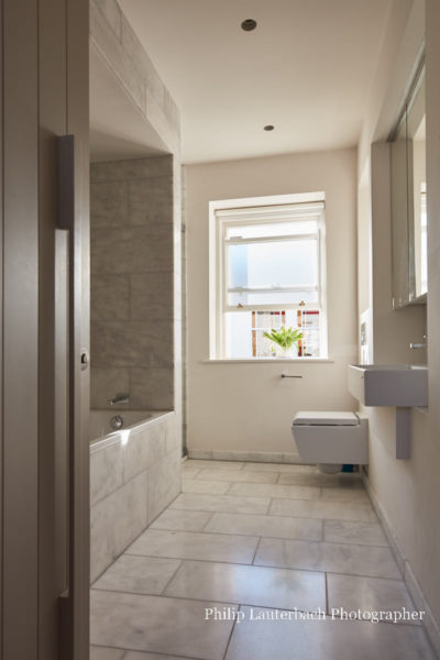 Bathroom,mirror,bath tub ,wall tiling,sink,window,floor tiling