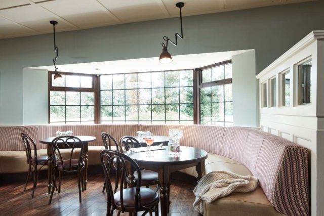 Bar seating tables timber panels pendant lighting