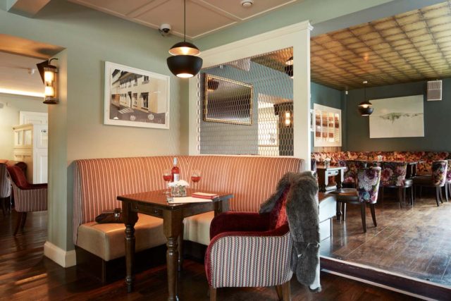 Bar seating tables timber panels pendant lighting